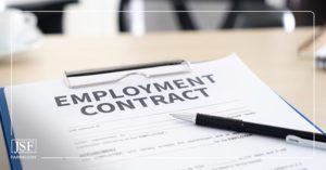 A black pen on an employment contract attached to a blue clipboard.